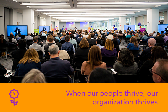 Point32Health colleagues seated in a conference room listening to a speaker