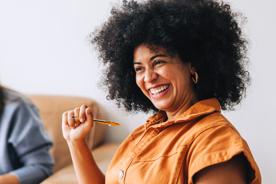 woman smiling during a work meeting